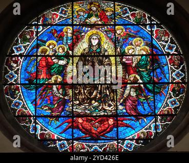 Virgin Mary surrounded by Angels by Lorenzo Ghiberti, 1405, stained glass window in the Cattedrale di Santa Maria del Fiore (Cat Stock Photo