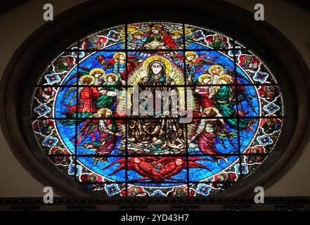 Virgin Mary surrounded by Angels by Lorenzo Ghiberti, 1405, stained glass window in the Cattedrale di Santa Maria del Fiore (Cat Stock Photo