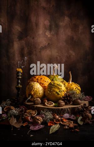 Top view of various pumpkins, nuts, recently extinguished candle Stock Photo