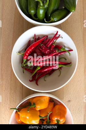 Fresh garden harvest of assorted spicy peppers Stock Photo
