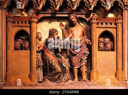 Appearance to Thomas, carved and painted frieze inside Notre Dame Cathedral in Paris, France Stock Photo