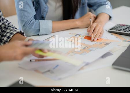 Asian Architects designer team working together meeting in startup office Stock Photo
