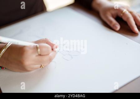 Young asian woman artist painting on canvas. Female artist drawingÂ with inspiration in garden Stock Photo