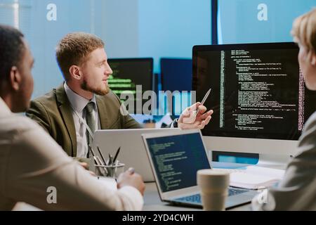 Cybersecurity Specialists Working in Team Stock Photo
