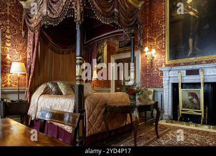 Interior view of the Red Bedroom at Holkham Hall, Wells-next-the-Sea, North Norfolk, Norfolk, England, UK Stock Photo