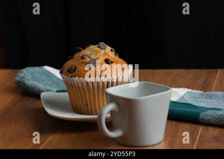 Ceramic cup and chocolate chip muffin Stock Photo