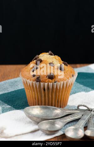 Chocolate chip muffin and measuring spoons Stock Photo