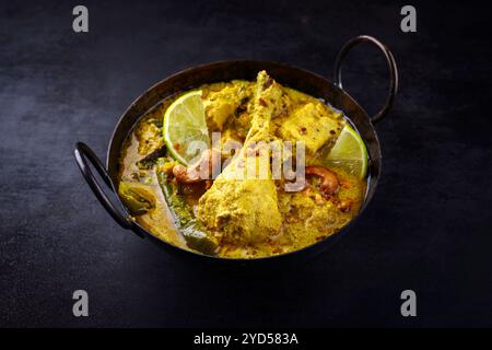 Traditional spicy Indian chicken Madras curry with drumsticks Stock Photo