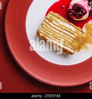 Napoleon cake with vanilla ice cream with cherry jam Stock Photo