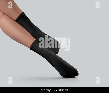 Mockup of black high socks with elastic band on female stretched feet, front view, diagonal presentation, isolated on background. Template of pair of Stock Photo