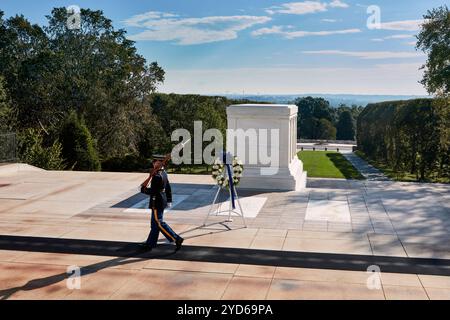 A solemn honour guard patrols the Tomb of the Unknown Soldier, symbolising respect and remembrance for fallen soldiers. The memorial is surrounded by Stock Photo