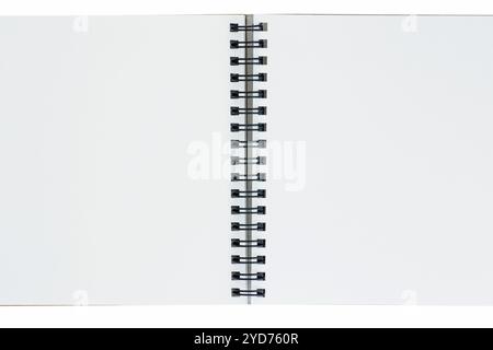 close up of opened sketch book with spiral bound against white background Stock Photo