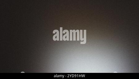 Grainy textured background fading from dark to light Stock Photo