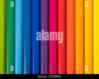 Arrangement of colored pencils in a row vertically. Stock Photo