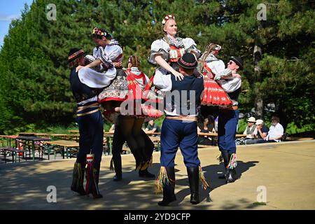 Brno - Bystrc, Czech Republic, 22 June, 2024. Czech traditional feast. Tradition folk dancing and entertainment. Girls and boys in costumes dancing on Stock Photo