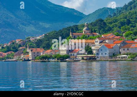 Stunning views of Kotor, Montenegro's historic coastal town, featuring medieval architecture, picturesque seashore, and majestic mountains. Stock Photo