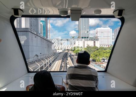 MIAMI - September 10, 2019: Father and son, view from inside of train in Miami downtown Stock Photo