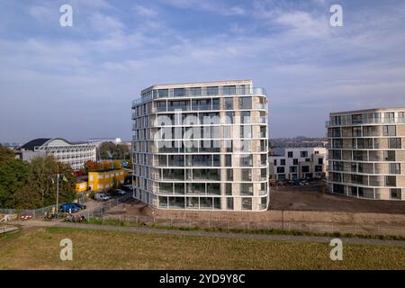 Aerial rising exterior facades of newly build luxury apartment towers ...