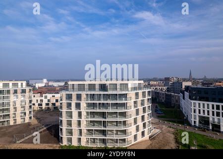 Aerial rising exterior facades of newly build luxury apartment towers ...
