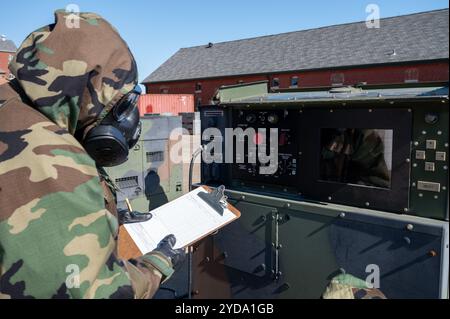 HVAC and power production Airmen with the 131st Bomb Wing perform their duties during a chemical, biological, radiological, nuclear, and explosives (C Stock Photo