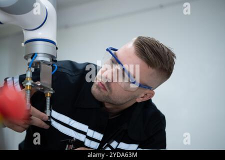 Students studying robotic hand technology are learning how to construct robotic hands for a range of industrial uses. Stock Photo