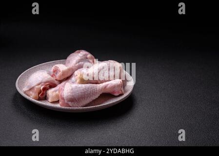 Fresh raw chicken legs with salt and spices Stock Photo