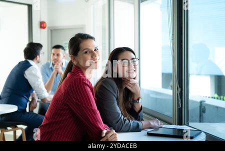 New business group person get serious about doing business, Even during the meeting's break, they continued to analyze and exchange ideas. Stock Photo