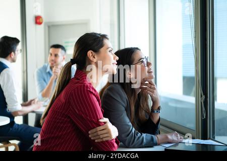 New business group person get serious about doing business, Even during the meeting's break, they continued to analyze and exchange ideas. Stock Photo