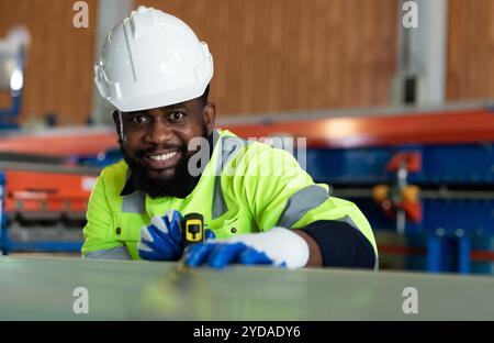Young engineers engineers testing and confirming that the machinery at the factory Stock Photo
