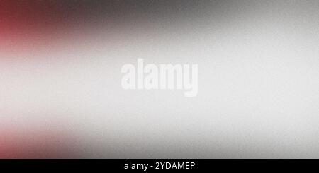 Silver surface with visible grain texture and a red hue fading from the left side of the frame Stock Photo