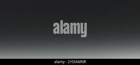 Grainy textured background featuring a gradient from black to white, offering ample copy space Stock Photo
