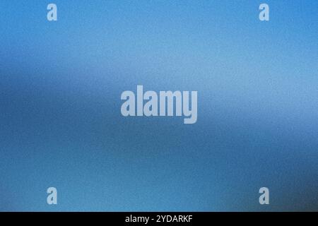 Subtle gradient on abstract blue background with fine grain texture Stock Photo