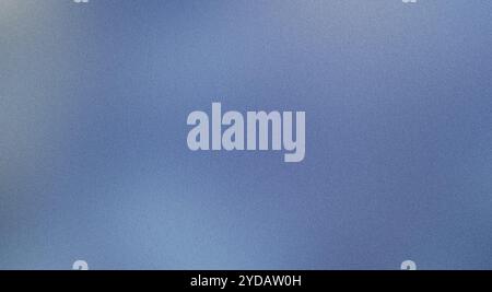 Subtle gradient effect created by grainy texture on a blue background Stock Photo