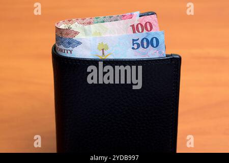 Saudi Riyal in the black wallet Stock Photo - Alamy