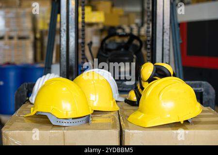A helmet for technicians or engineers to wear when working. for the safety of the head and ear muffs to prevent noise Placed on Stock Photo