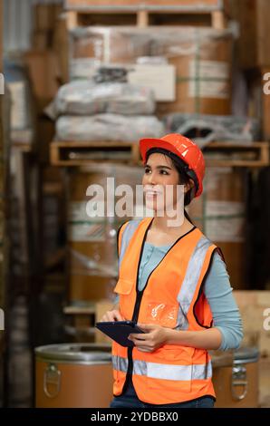Portrait of an Asian female engineer with the personality of working in the warehouse Stock Photo