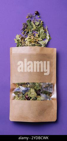 Paper bag with scattered dried tea Stock Photo