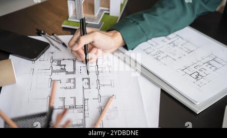 Architecture Man drawing on architectural Creative project business architecture building constructionÂ Industrial engineering A Stock Photo