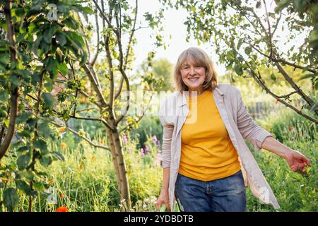 A close-up portrait of a laughing mature woman in casual clothes Stock Photo