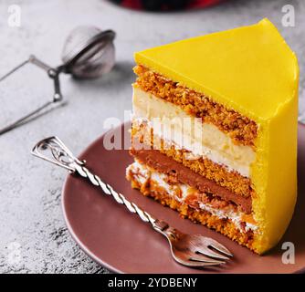 Tasty mango mousse cake on plate Stock Photo