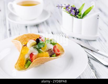 Two scoops of natural organic fruit ice cream in a wafer cup Stock Photo