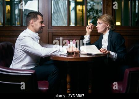 Business people talking over coffee in cafe Stock Photo