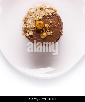 Kyiv cake with hazelnuts, chocolate glaze, and a buttercream-like filling Stock Photo