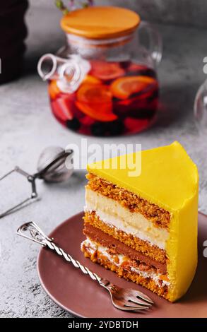 Tasty mango mousse cake on plate Stock Photo