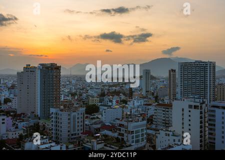 This is a city center view of Nha Trang with mountains in the distance during sunset on June 02, 2023 in Nha Trang, Vietnam Stock Photo