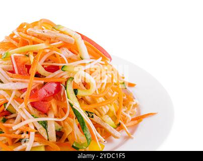 Salad of carrots, cucumbers and peppers on plate Stock Photo