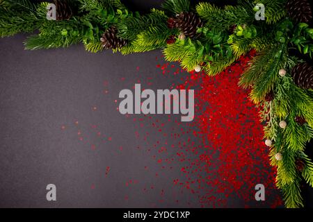 Christmas tree branches on the black background. flat lay, top view with copy space Stock Photo