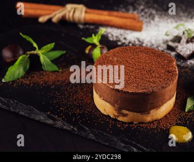 Mango and chocolate mousse on wooden black Stock Photo