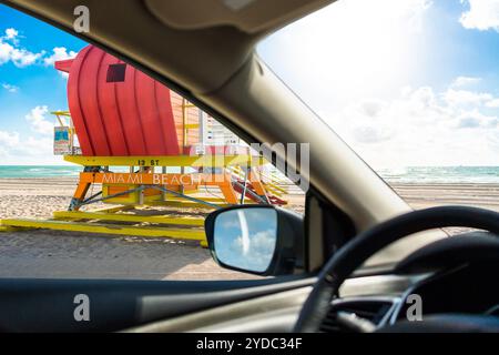 Lifeguard station in miami beach, florida, america, usa at sunset, view from car, driving on a beach Stock Photo