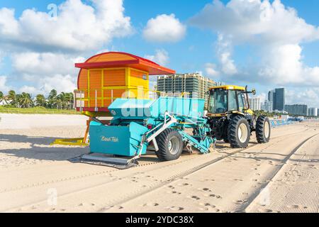 Miami, USA - September 11, 2019: Tractor cleaning sand in South beach in Miami Stock Photo